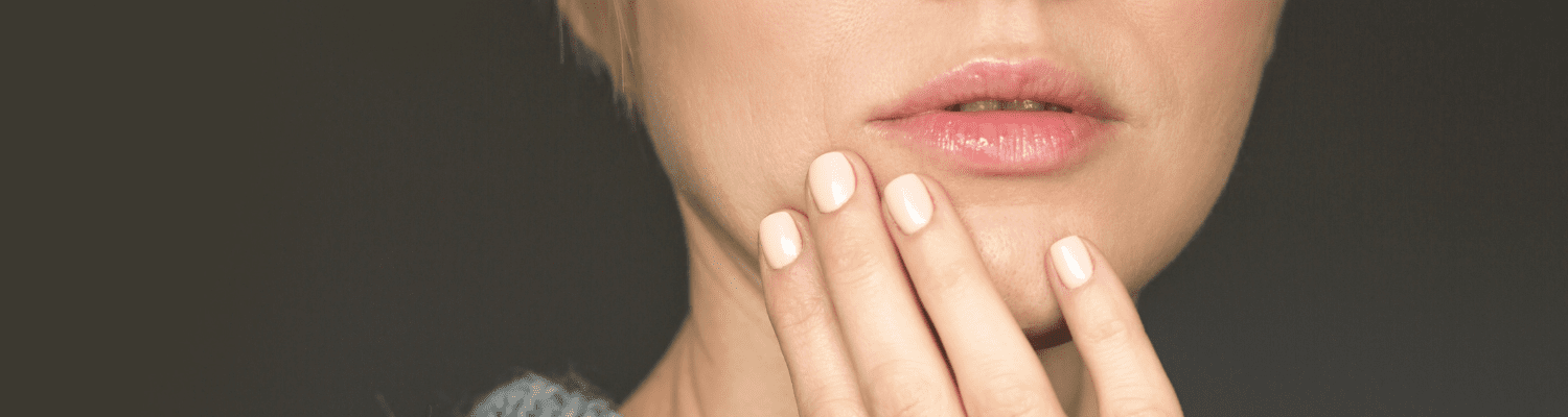 Close up of a woman touching her mouth