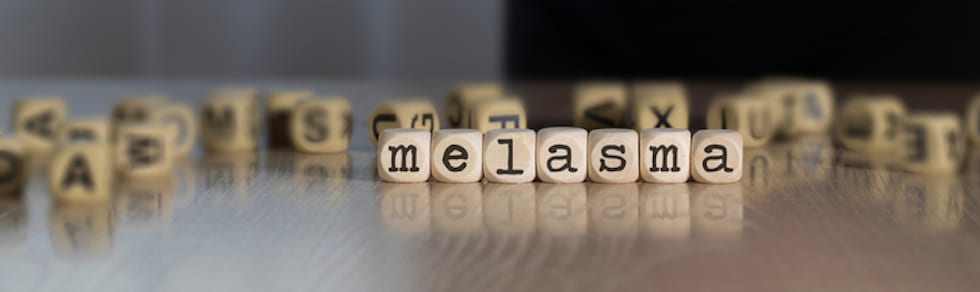 word titles spelling out melasma with various letters in the background