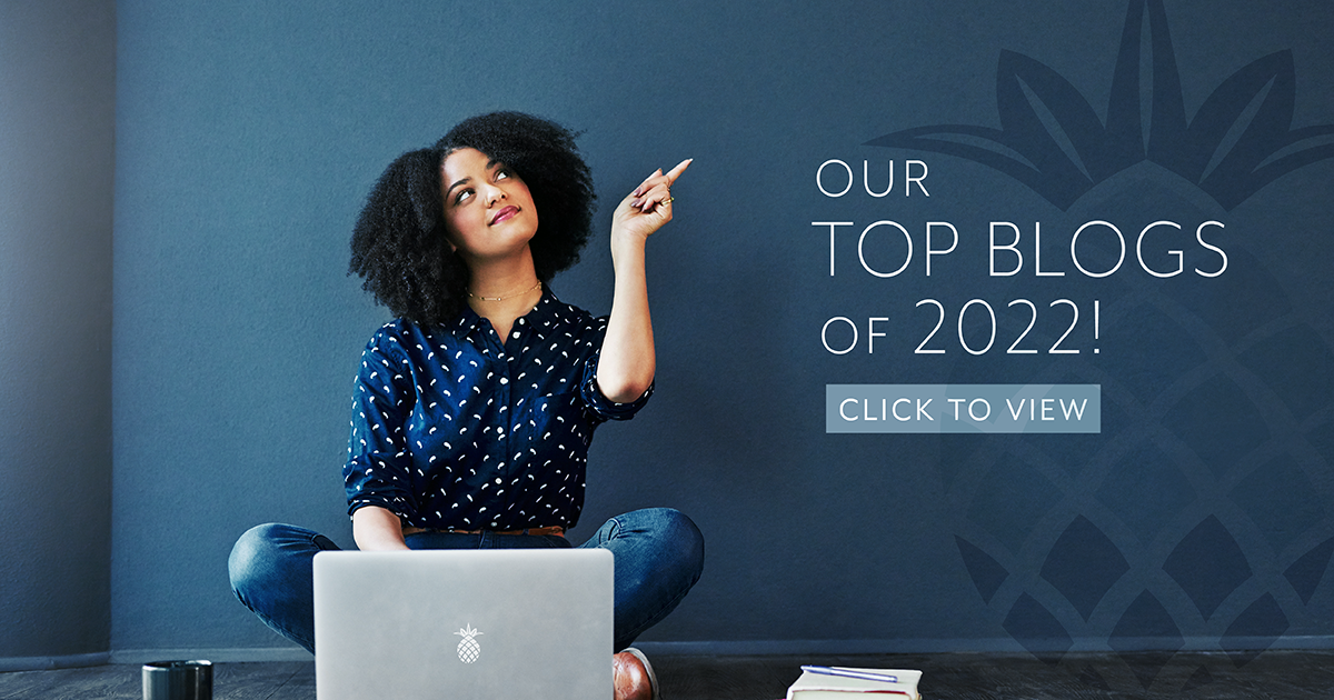 Our top blogs is 2022! A woman on a computer is pointing to the title