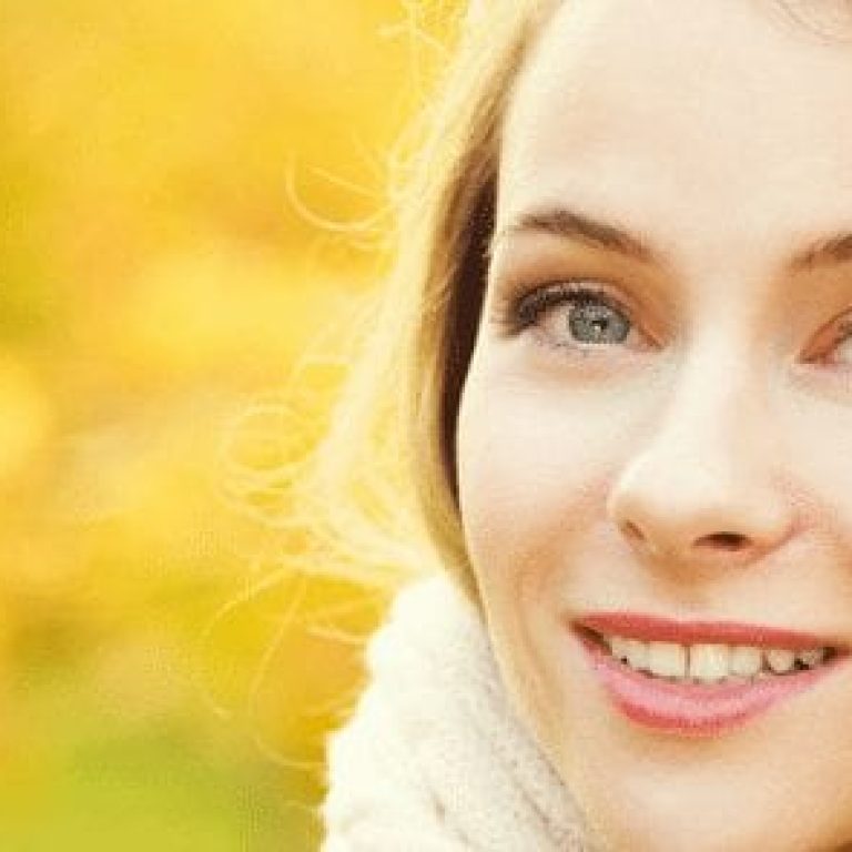 Girl wearing scarf outside smiling