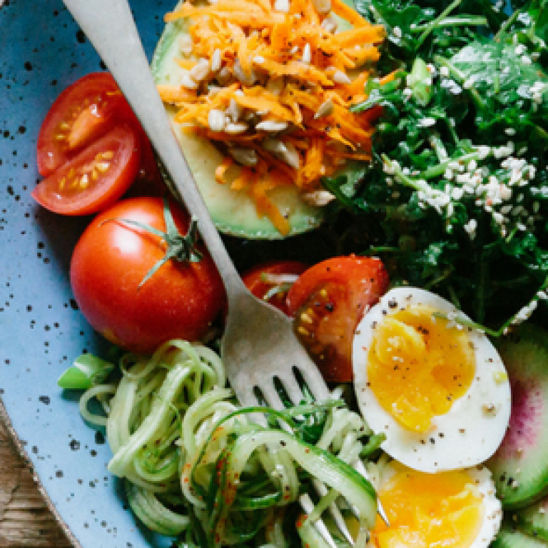 Healthy foods on a plate with fork