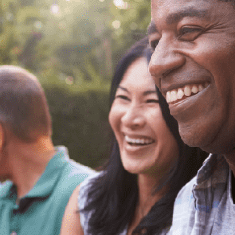 Family gathering outside and laughing