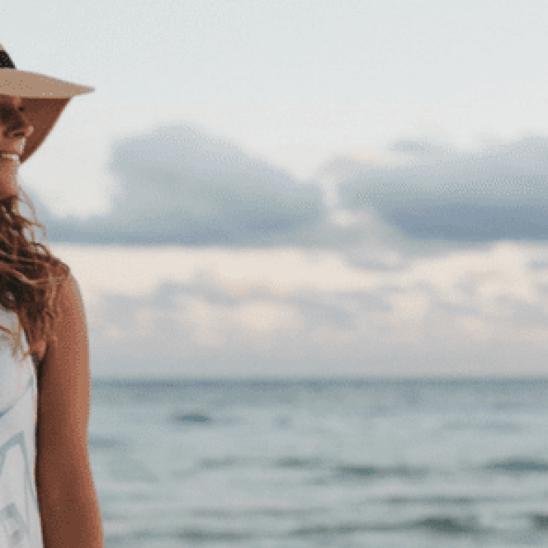 Woman smiling on the beach