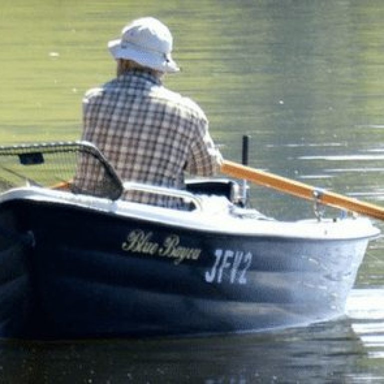 Man rowing boat in water