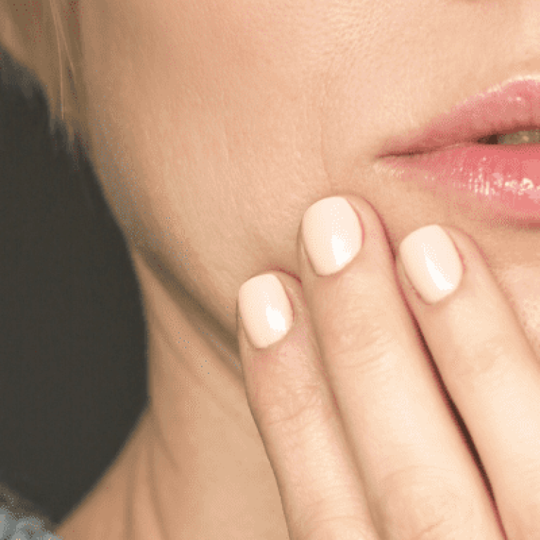 Close up of a woman touching her mouth