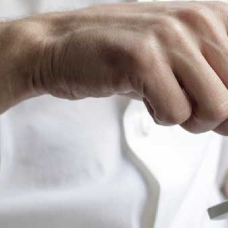 Person hitting button on their phone