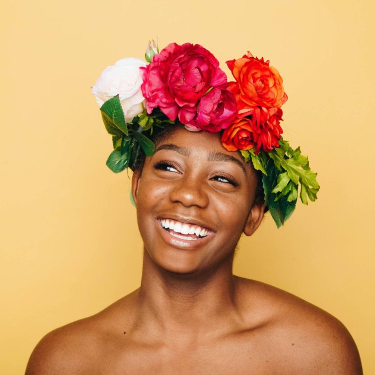 Woman smiling and wearing a flower crown