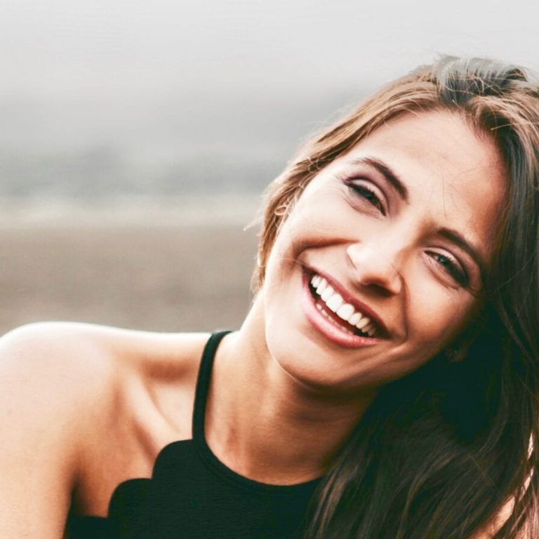 Woman outside laughing
