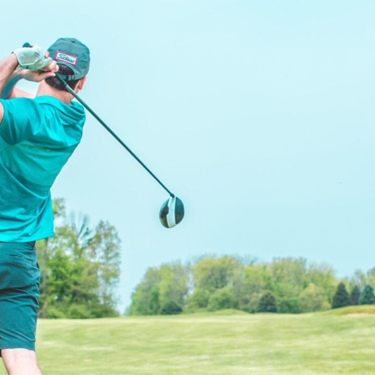 Man finishing his golf swing