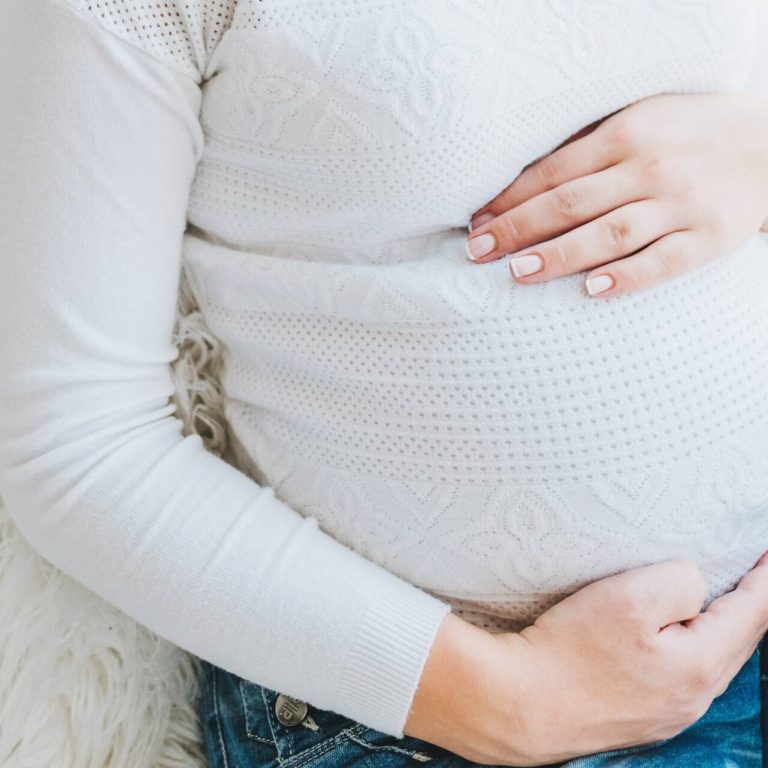 Pregnant mom holding her belly