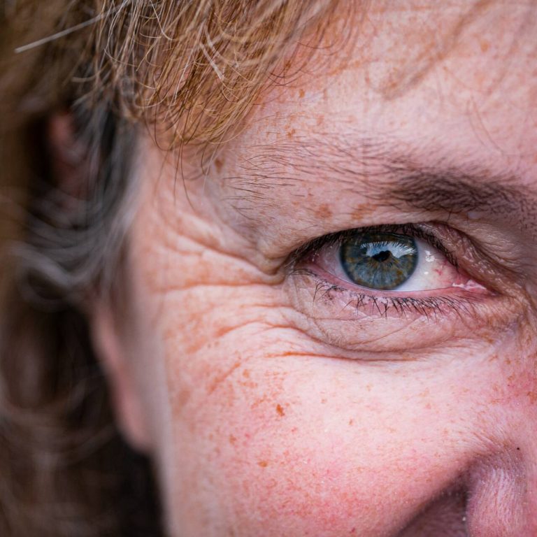 Close up of a woman eye and face wrinkles
